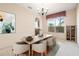 Staged dining room featuring a modern table, stylish chairs, and decorative artwork at 3633 Sickle St, Orlando, FL 32812