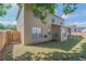 Two-story home exterior with a well-maintained lawn and partial fence at 3633 Sickle St, Orlando, FL 32812
