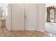 Bright entryway featuring double doors, tile floors, and a view of the living room and staircase at 3633 Sickle St, Orlando, FL 32812