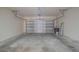 Spacious garage with a concrete floor and an open garage door at 3633 Sickle St, Orlando, FL 32812