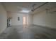 Garage space showing concrete floor and water heater at 3633 Sickle St, Orlando, FL 32812