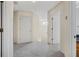 Hallway with carpet floor, white walls, and doors leading to rooms at 3633 Sickle St, Orlando, FL 32812