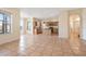 Open-concept kitchen with tiled flooring, wooden cabinets, stainless steel appliances, and lots of natural light at 3633 Sickle St, Orlando, FL 32812