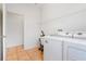 Practical laundry room with washer, dryer, and utility sink on tiled floor at 3633 Sickle St, Orlando, FL 32812
