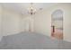Open living area with neutral carpet, recessed lighting, and view to the kitchen at 3633 Sickle St, Orlando, FL 32812