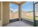 Enclosed patio featuring tiled flooring and a spacious outdoor view with secure wood fencing, perfect for outdoor enjoyment at 3633 Sickle St, Orlando, FL 32812
