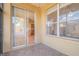 View of a cozy patio with tile flooring, sliding glass doors leading to the home's interior, and a pleasant outdoor space at 3633 Sickle St, Orlando, FL 32812