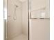 Tiled shower features adjustable shower head and glass door at 3633 Sickle St, Orlando, FL 32812