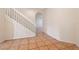 A clean, bright staircase with white railing, tile floors, and an archway to another room at 3633 Sickle St, Orlando, FL 32812