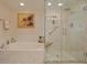 Spa-like bathroom featuring a soaking tub and a walk-in shower at 4 Oceans West Blvd # 502D, Daytona Beach Shores, FL 32118