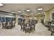 Community room with tables and chairs for gatherings at 4 Oceans West Blvd # 502D, Daytona Beach Shores, FL 32118