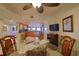 Casual dining area with glass-top table and view into the kitchen at 4 Oceans West Blvd # 502D, Daytona Beach Shores, FL 32118
