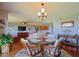 Bright dining area with wood floors and a glass-top table, perfect for enjoying meals at 4 Oceans West Blvd # 502D, Daytona Beach Shores, FL 32118