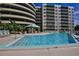Resort-style pool with surrounding lounge chairs at 4 Oceans West Blvd # 502D, Daytona Beach Shores, FL 32118