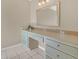 Bathroom vanity with drawers, countertop, and a large mirror with vanity lighting at 510 Sandy Bluff Trl, Deland, FL 32724