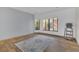 Bedroom featuring wood flooring, white walls, neutral rug and natural light at 510 Sandy Bluff Trl, Deland, FL 32724