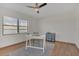 Bedroom featuring a desk, large window with a view, and hardwood floors at 510 Sandy Bluff Trl, Deland, FL 32724
