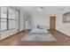 Spacious bedroom featuring hardwood floors, large window and a decorative rug at 510 Sandy Bluff Trl, Deland, FL 32724