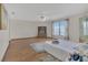 Bright bedroom boasts hardwood floors, built-in storage, and a large window at 510 Sandy Bluff Trl, Deland, FL 32724