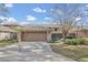 Charming single-story home with a two-car garage and well-maintained landscaping at 510 Sandy Bluff Trl, Deland, FL 32724
