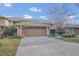 Charming single-story home with a two-car garage and well-maintained landscaping at 510 Sandy Bluff Trl, Deland, FL 32724