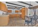 Spacious kitchen with wooden cabinets, sleek countertops, and a dining area with a view at 510 Sandy Bluff Trl, Deland, FL 32724