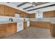 Bright kitchen with wooden cabinets, white appliances, and modern countertops at 510 Sandy Bluff Trl, Deland, FL 32724