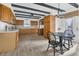 Spacious kitchen with wooden cabinets, sleek countertops, and a dining area with a view at 510 Sandy Bluff Trl, Deland, FL 32724