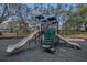 Community playground with slides, climbing structures, and a cushioned surface for safety at 510 Sandy Bluff Trl, Deland, FL 32724