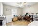 Bright bedroom with a ceiling fan and plenty of room for a desk or office space at 583 Wilburton Dr, Deltona, FL 32738