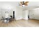 Open-concept dining area with tile floors, a modern chandelier, and seamless transition to other living spaces at 583 Wilburton Dr, Deltona, FL 32738
