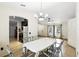 Open-concept dining area next to the kitchen, featuring tile floors and abundant natural light at 583 Wilburton Dr, Deltona, FL 32738