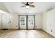 Inviting living space with tile floors, arched windows, and neutral decor, creating a bright and welcoming atmosphere at 583 Wilburton Dr, Deltona, FL 32738