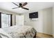 The main bedroom features tile floors, a ceiling fan, and an adjacent bathroom at 583 Wilburton Dr, Deltona, FL 32738