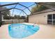 Inviting screened-in pool with surrounding patio at 583 Wilburton Dr, Deltona, FL 32738