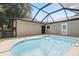 Screened-in porch with an in-ground pool and doors leading into the home at 583 Wilburton Dr, Deltona, FL 32738