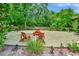 Community recreation area with tables and chairs surrounded by lush landscaping and mature trees at 600 N Boundary Ave # 109C, Deland, FL 32720