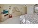 Spacious bedroom with a full dresser and closet showing ample storage with relaxing neutral color and bright natural lighting at 600 N Boundary Ave # 114B, Deland, FL 32720