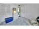 Bright bedroom featuring gray carpet, a large closet, and white walls at 600 N Boundary Ave # 114B, Deland, FL 32720