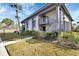 Well-maintained condo building with neat landscaping and staircase access at 600 N Boundary Ave # 114B, Deland, FL 32720