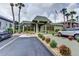 Well-maintained clubhouse surrounded by tropical landscaping, providing a welcoming space for community activities and gatherings at 600 N Boundary Ave # 114B, Deland, FL 32720