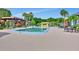 Inviting community pool area featuring ample seating and well-maintained landscaping for residents to enjoy at 600 N Boundary Ave # 114B, Deland, FL 32720