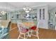 Dining area showcasing a view to the kitchen, a chandelier, and light-colored walls at 600 N Boundary Ave # 114B, Deland, FL 32720