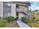 Condo exterior featuring a well-maintained facade, lush landscaping, and inviting entrance at 600 N Boundary Ave # 114B, Deland, FL 32720