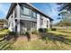 Condo building with well-kept grounds and a covered screened-in porch at 600 N Boundary Ave # 114B, Deland, FL 32720