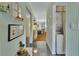 Hallway includes decor, tile flooring, with a laundry setup with a washer and dryer at 600 N Boundary Ave # 114B, Deland, FL 32720