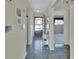 Inviting hallway with charming decor leads to the main living spaces, showcasing the home's open and airy layout at 600 N Boundary Ave # 114B, Deland, FL 32720