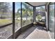 View from the lanai overlooking the manicured backyard and communal pool area at 600 N Boundary Ave # 114B, Deland, FL 32720