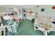 Bright, cheerful living room open to the kitchen, furnished with stylish seating and decor at 600 N Boundary Ave # 114B, Deland, FL 32720