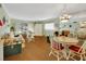 Open floor plan with hardwood floors, a dining area, and comfortable seating at 600 N Boundary Ave # 114B, Deland, FL 32720